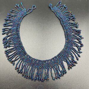 Handcrafted, seed bead necklace with an iridescent peacock tone choker goddess